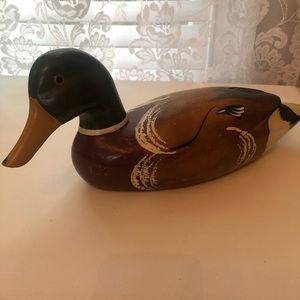 Mid century hand carved wooden duck decoy with glass eyes.